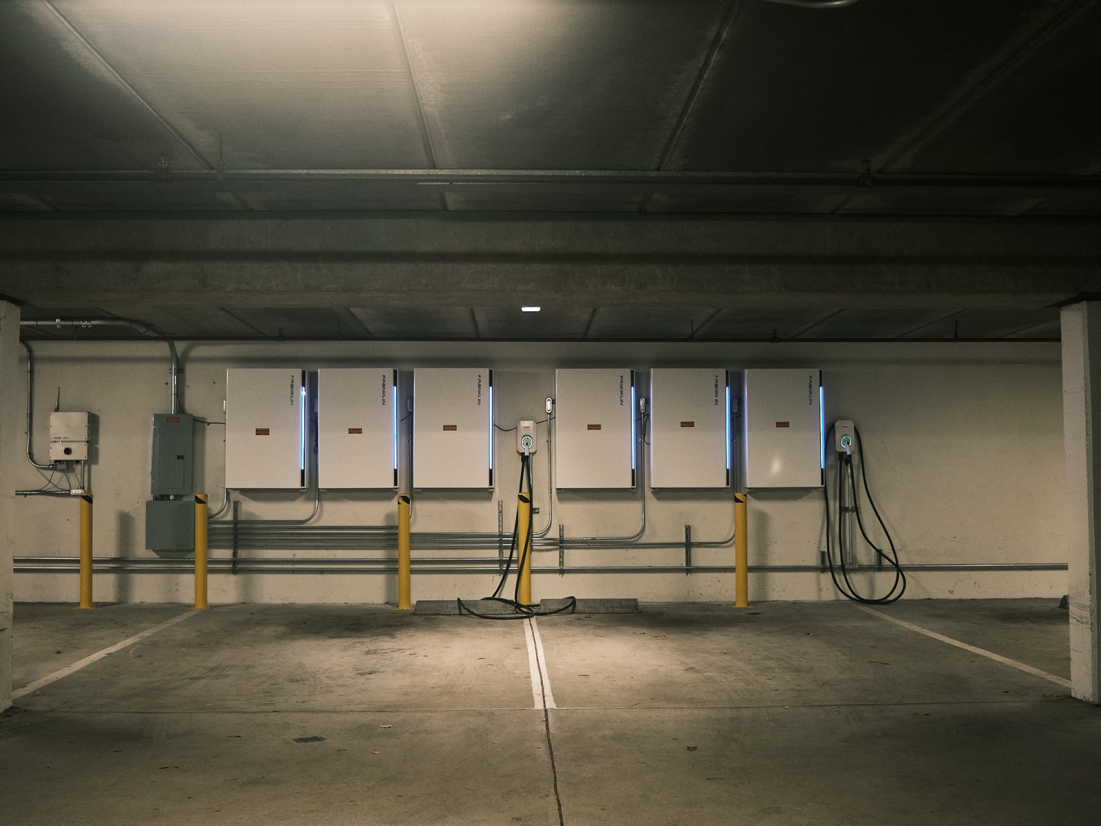 MYNT EV chargers and FranklinWH batteries in a parking garage